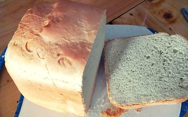 Bread Machine Bread Recipe bread sliced on a white cutting board