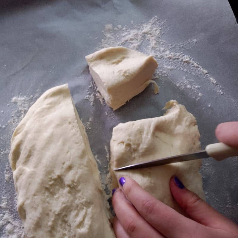 cutting pretzel bun dough